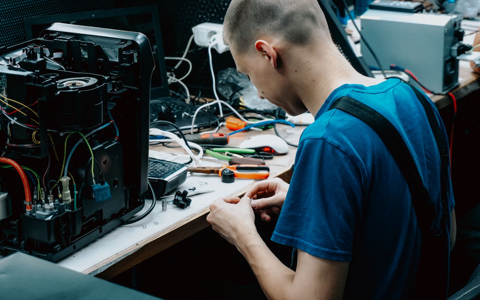 An engineer arriving at a business with a laptop bag