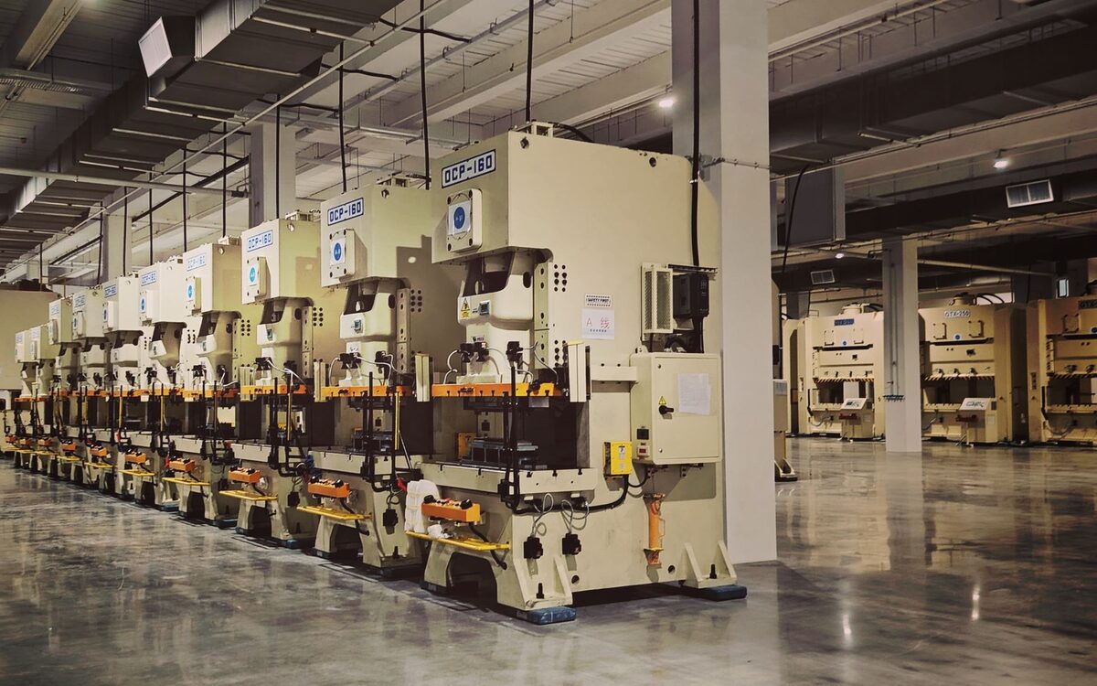 A machine operator working on a production line