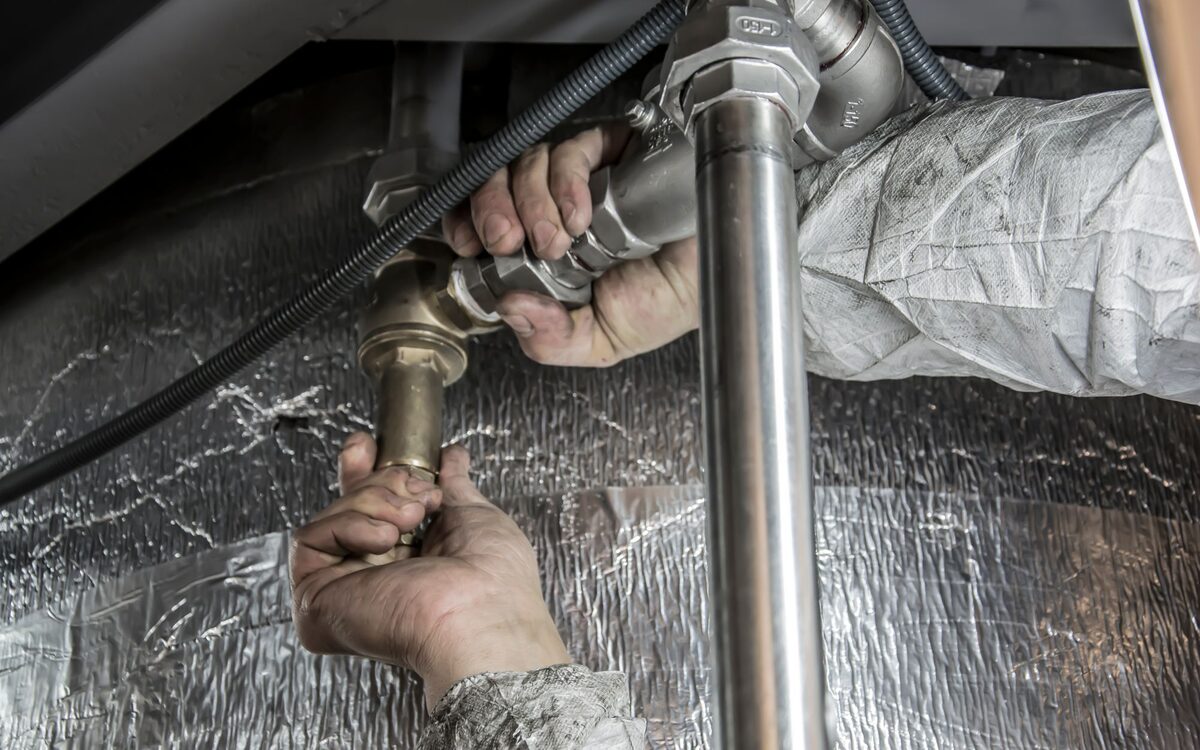 A tradesperson working on a domestic installation