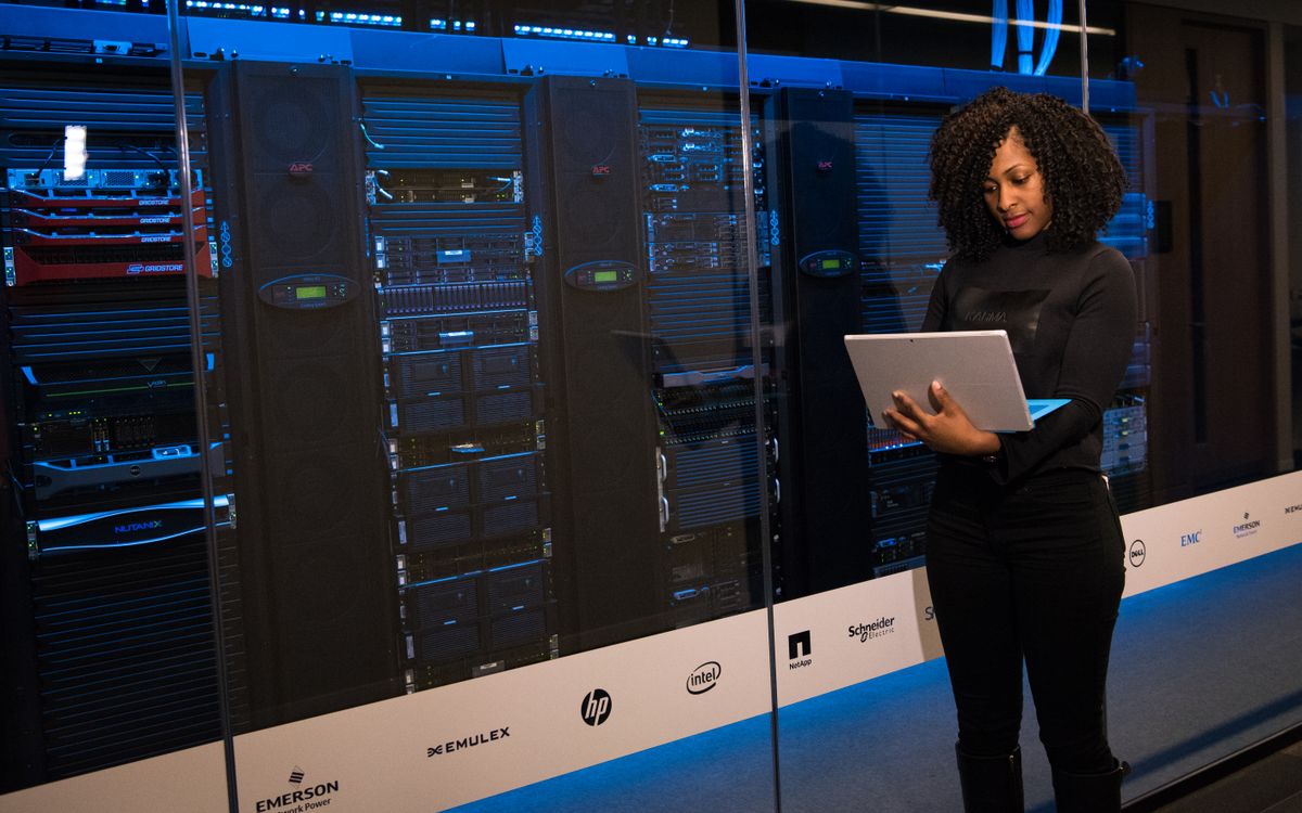 An engineer checking servers with a laptop
