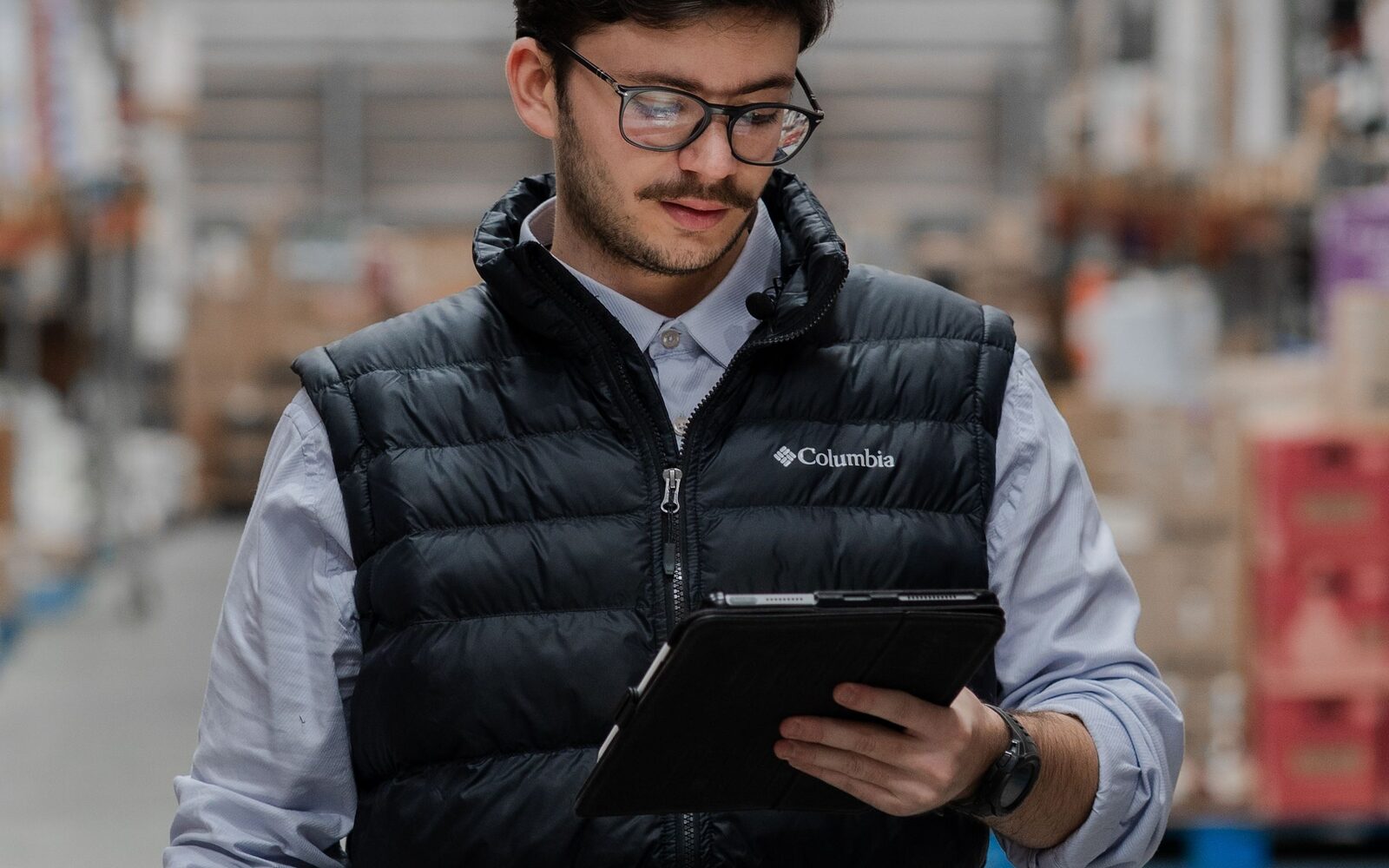 A person reviewing an automated process on a laptop